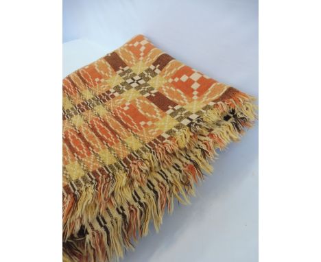 A large Welsh wool tapestry blanket with geometric designs in tones of orange and brown, 86 1/2 x 83 1/2".