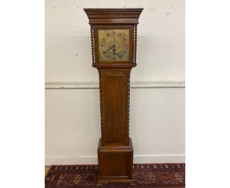 An oak carved eight day longcase clock with a square brass dial bearing the name David Scott 1926. 