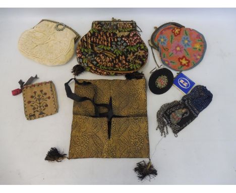 A group of lady's purses and accessories with detailed tapestry and beadwork. 