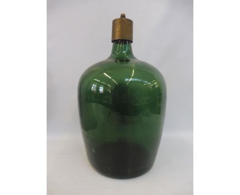 A large green glass bottle with later brass lamp fitting, 16 1/2" high. 