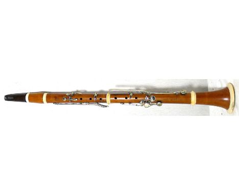 Mid-19th century boxwood clarinet. Ivory mounts. A. Ferry. Paris. Good general condition. Some minor restorations. One key ho