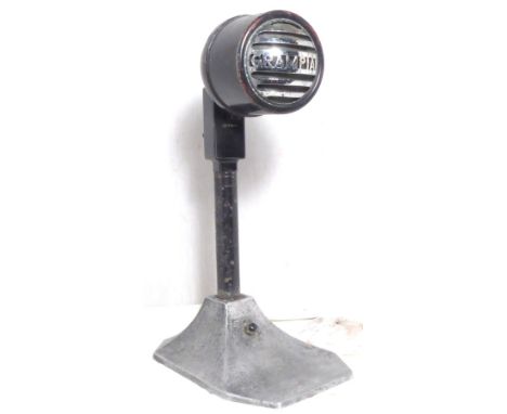 Free standing microphone marked Grampian, metal, head on a bracket and with an on/off switch 