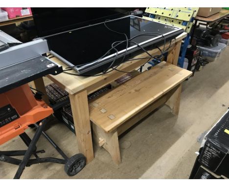 A pine kitchen table and a bench