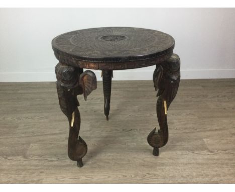 20TH CENTURY INDIAN CARVED WOOD CIRCULAR TEA TABLE, the three supports each formed as an elephant head and trunk, 53cm diamet