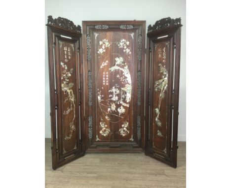 EARLY 20TH CENTURY CHINESE HARDWOOD THREE PANEL DRESSING SCREEN, profusely inlaid allover with mother of pearl, the front pan