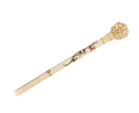 JAPANESE IVORY AND SHIBAYAMA PARASOL HANDLE, the finial carved with many faces, the simulated bamboo shaft with mother of pea