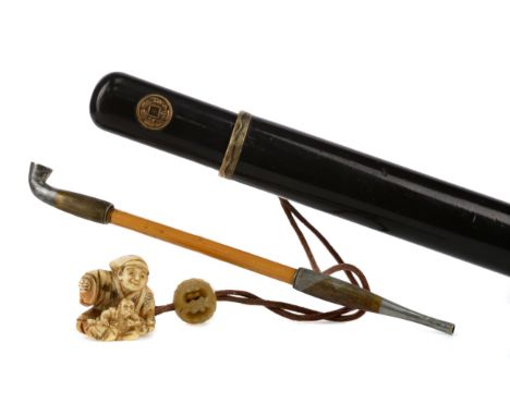 EARLY 20TH CENTURY JAPANESE LACQUERED OPIUM PIPE CASE, with gilt metal roundels, and with a Japanese ivory netsuke modelled w