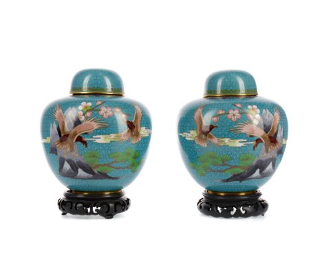 PAIR OF 20TH CENTURY CHINESE CLOISONNE ENAMEL GINGER JARS WITH COVERS, of broad oviform and decorated with birds, mountains a