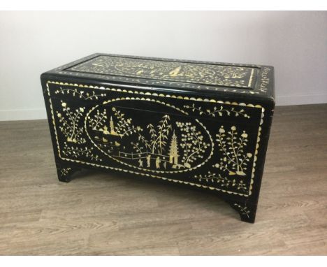 20TH CENTURY CHINESE EBONISED CAMPHORWOOD BLANKET CHEST, the hinged rectangular top, front and sides richly inlaid with figur