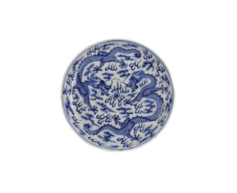EARLY 20TH CENTURY CHINESE BLUE AND WHITE CIRCULAR DISH, painted six character mark in blue to base, painted with dragons cha