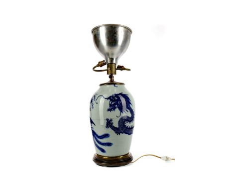 EARLY 20TH CENTURY CHINESE BLUE AND WHITE VASE, adapted to a lamp, painted with a dragon chasing a pearl and a pheonix, with 