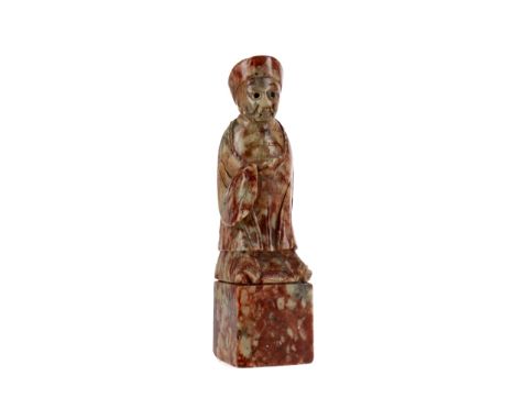 CHINESE SOAPSTONE SEAL, carved in the form of a male figure, 17cm high