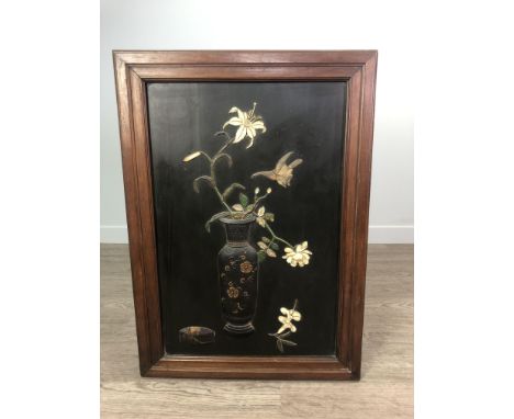 EARLY 20TH CENTURY CHINESE WALL PANEL, depicting a vase with flowers and a bird, decorated in relief with green lacquer, moth