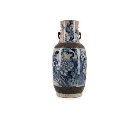 EARLY 20TH CENTURY CHINESE CRACKLE GLAZE VASE, painted with a peacocks and flowering branches in shades of blue, reduced in h