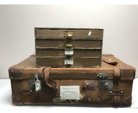 A vintage leather luggage case together with a desk top four drawer index chest