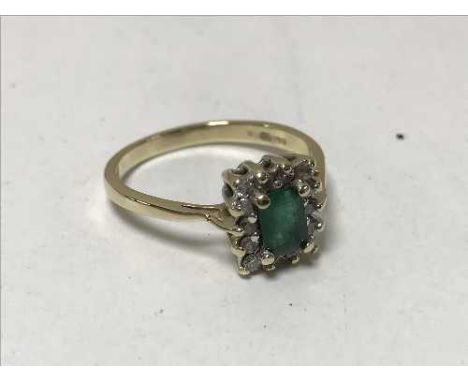 A 9ct gold emerald and diamond cluster ring, 2.6g