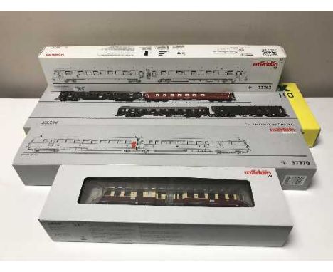 Three Marklin diesel rail cars 33762, 37770, 37707 together with a Trix passenger car set 23394, HO scale all parts boxed.