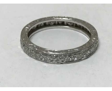 A platinum diamond eternity ring, size L.