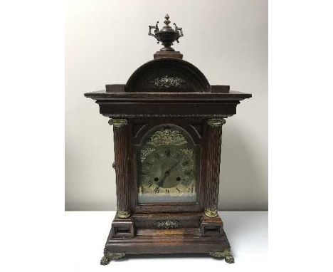 A nineteenth century oak bracket clock with brass dial