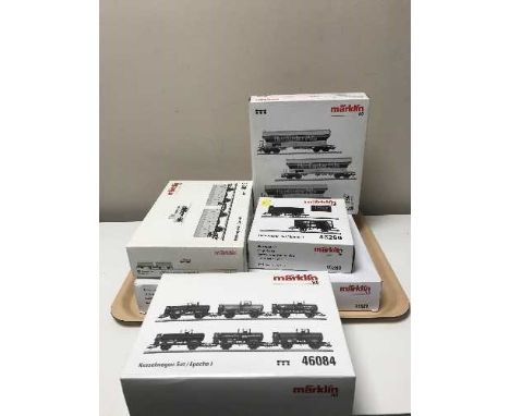 A Marklin express train passenger car set 41928 together with four freight, milk and tank car sets 46084, 45260, 48815 and 46