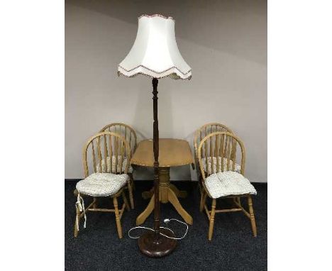 A contemporary drop leaf kitchen table and four chairs, standard lamp with shade 