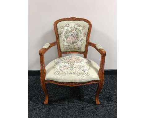 A floral tapestry upholstered armchair 