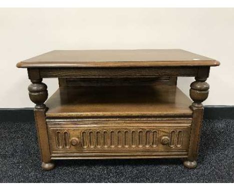 An Ercol flap sided coffee table fitted with a drawer 