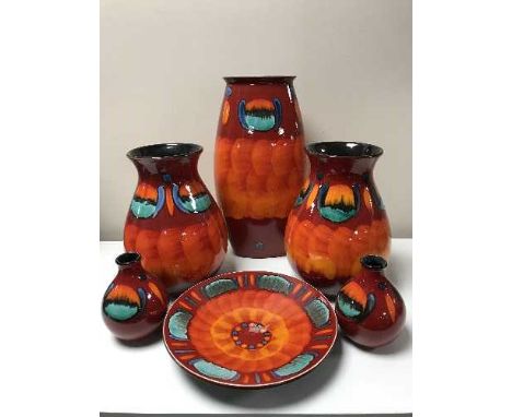 Six pieces of Poole volcano red pottery 