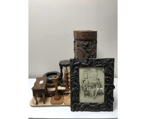 A tray of two heavily carved wooden vases, wooden candlesticks, miniature Victorian inlaid dressing table, wooden egg timer e