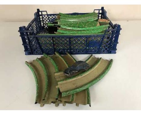 A box of vintage tin plate track and a tin plate car 