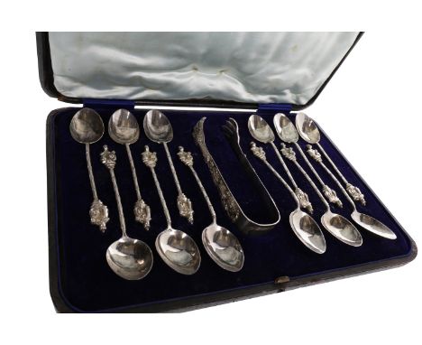 SET OF TWELVE CHINESE SILVER TEASPOONS with sugar tongs, the spoons with figural finials and the tongs modelled as dragon cla