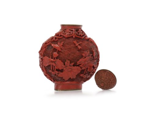 20TH CENTURY CHINESE CINNABAR LACQUER SNUFF BOTTLE carved with flowers and insects, 6cm high 