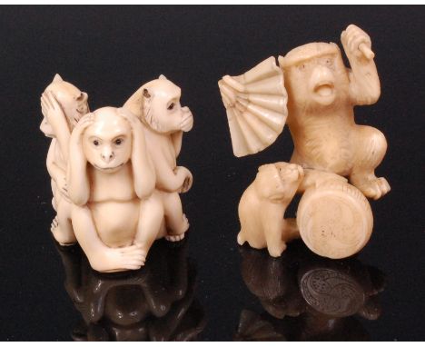 A Japanese carved ivory netsuke of the three wise monkeys, each in seated pose, with penwork decoration, signed verso, Meiji 