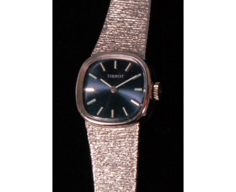 A ladies Tissot 9ct white gold cased wristwatch, having a signed square dial with baton markers, manual wind movement, and on