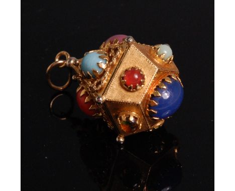 A late 20th century Middle Eastern yellow metal and semi-precious set pendant, being five-sided and set with various cabochon