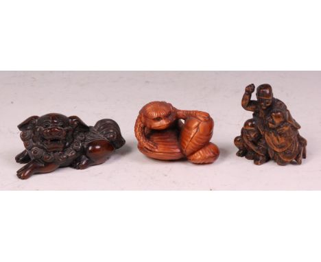 A Japanese carved wood netsuke as a recumbent shishi, signed to seal verso, Meiji period, 6.5cm; one other late Edo/early Mei