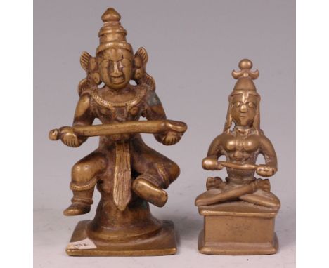 An Indian brass shrine deity figure of Annapurna Devi, in seated pose holding ladle of plenty, h.10cm; and one other of Paras