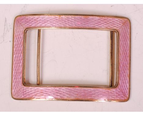 An early 20th century silver gilt and guilloche pink enamel belt buckle, of rectangular outline, 39.8g, stamped 950 with impo
