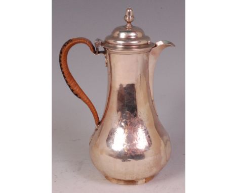 A George II silver hot water pot, having finial topped and hinged dome cover, engraved armorial, 9.5oz, maker James Whipham, 