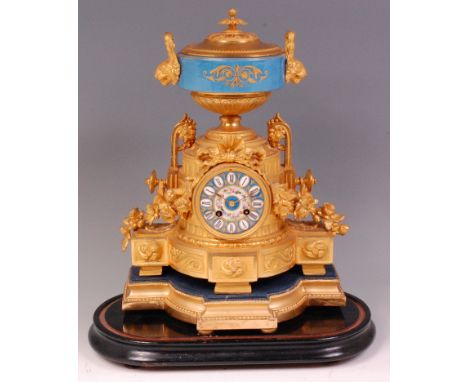 A 19th century French gilt metal and porcelain mantel clock, the whole surmounted with a pedestal urn with fixed cover, the c