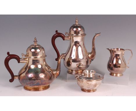 A modern silver four piece tea and coffee set, comprising; teapot, coffee pot, sugar with cover, and cream jug, the two pots 