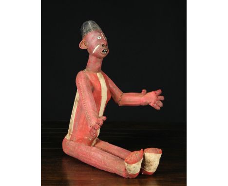 A Mid 20th Century Reliquary Figure from the Bembe Tribe of the Democratic Republic of Congo. The piece is made of cane armat