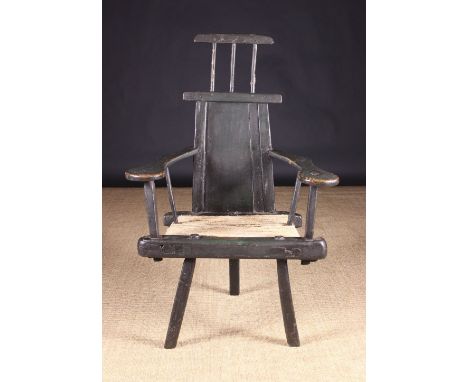 A Rare 18th Century Primitive Ash Country Armchair with residual green paintwork. The boarded back with bar top surmounted by