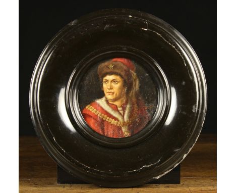 A Round Oil on Canvas laid onto Board: Head & shoulders Portrait of a Renaissance man, 6 ins (15 cms) in diameter, set in a b