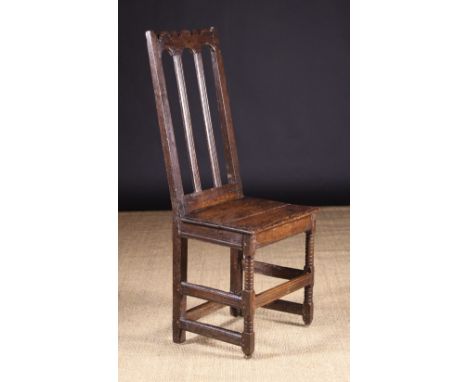 A Late 17th/Early 18th Century Joined Oak Chair (A/F). The top rail silhouette cut with arcading and embellished with punchwo