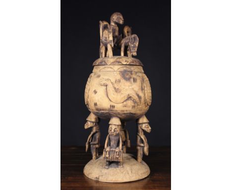 A Large and Beautifully carved Mid- Late 20th Century Senufo Ceremonial Offering Pot from the Ivory Coast. The Pot is decorat