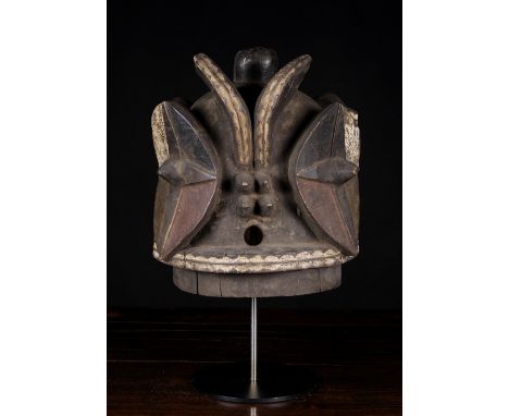 A Mid 20th Century Bembe Janus Helmet Mask Kalunga. This barrel shaped mask of the Bembe is said to embody forest spirits and