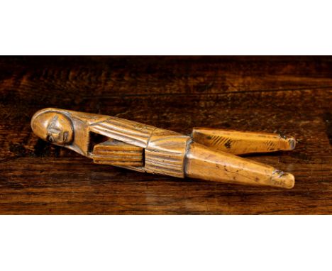 A Fine Mid 18th Century French Boxwood Lever Nutcracker, Circa 1750, of rich colour & patination, carved in the form of a wom