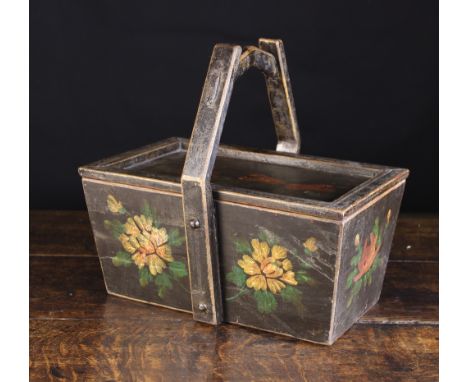 A Painted Wooden Folk Art Sewing Basket/Box decorated with flowers. The tapering rectangular container having a edge moulded 