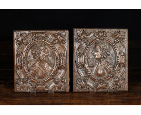A Pair of 17th Century Carved Oak Panels depicting portrait busts of a man & wife contained in a beaded oval centring a scrol